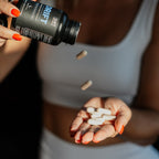 Woman pouring DRIFT sleep capsules from the bottle into her open hand